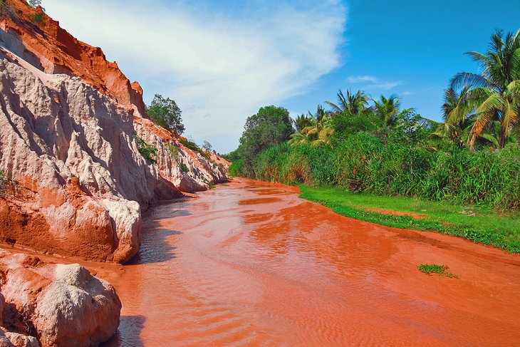 Red cliffs and river in Mui Ne